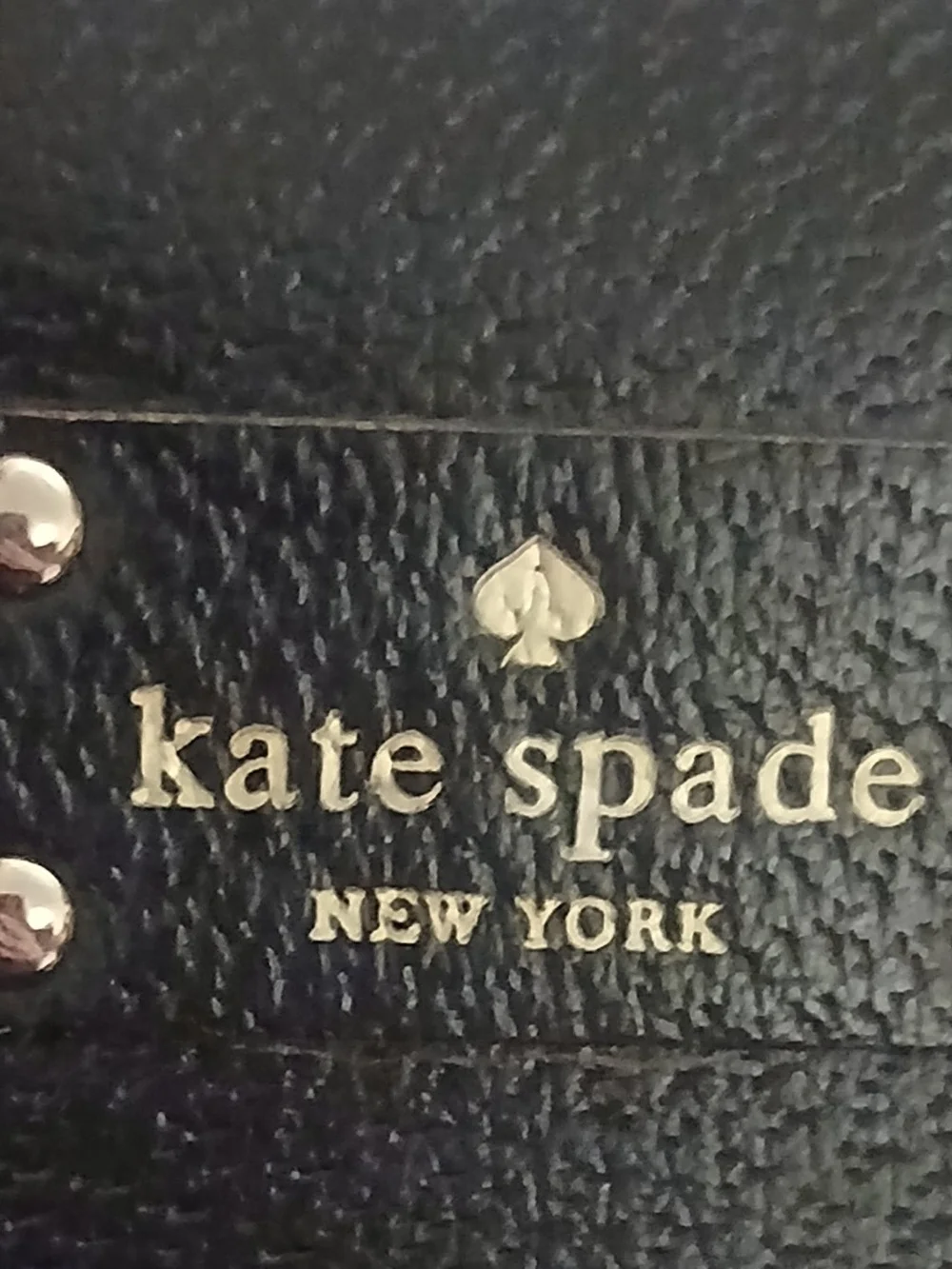 kate spade black leather satchel with polka-dot interior